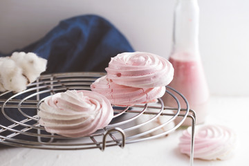 Raspberry meringue on concrete desk. Space for text. Close up view. Romatic wedding. 