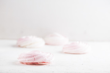 aspberry meringue on concrete desk. Space for text. Close up view. Romatic wedding.