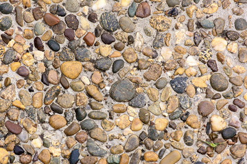 Pieces of stone beside rail track neutral background small pebbles track
