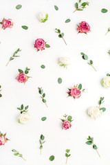 Floral pattern made of red and white rose flower buds and eucalyptus branches on white background. Fat lay, top view flowers background.