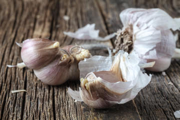 Ripe garlic head on wooden table