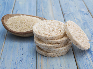 original rice cakes with rice on a blue wooden background.  