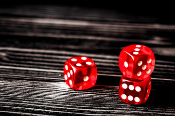 concept luck - dice gambling on dark wooden background