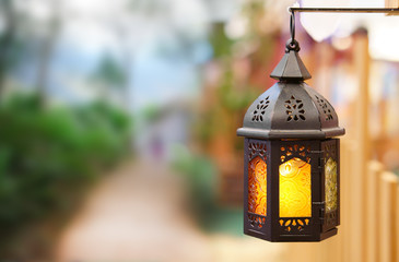 old vintage lantern or classic lamp and warm white light for interior or exterior architecture at...