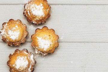 Delicious sweet cupcakes on white wooden table, delicious homemade dessert