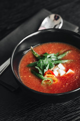 Delicious tomato soup with parsley and pepper