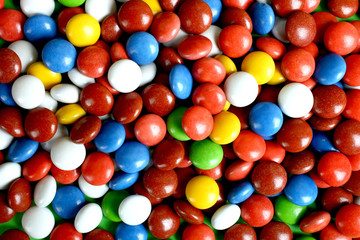 Chocolate pellet in colored glaze