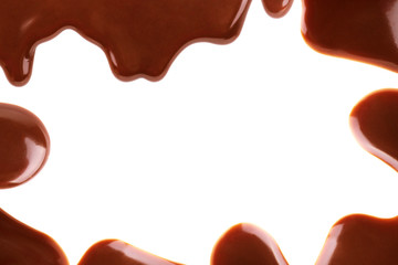 Chocolate syrup drips in shape of light bulb isolated on white