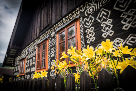 Unique decoration of log houses based on patterns used in traditional embroidery in village of Cicmany,(old wooden house) UNESCO World Heritage Site, Slovakia