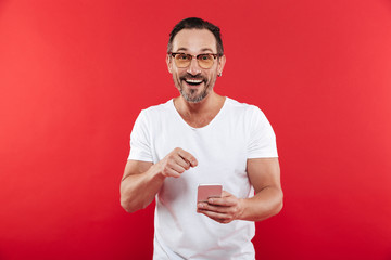 Adult happy emotional positive man in colorful sunglasses