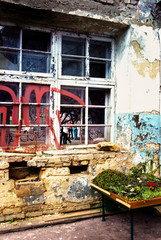 Fototapeta na wymiar Abandoned house exterior covered with graffiti