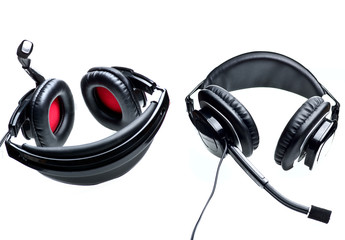 Black earphones with black and red padding, isolated on white