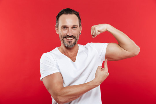 Smiling Adult Man Showing Biceps.