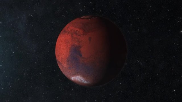 Traveling to the red planet Mars in space. The day/night terminator is visible as the Mars rotates.  