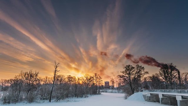 Dobrush, Gomel Region, Belarus. Time Lapse Timelapse Time-lapse Of Old Paper Factory Tower In Winter Morning. Sun In Sunrise Over Historical Heritage