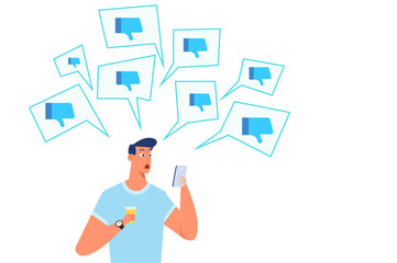 Thumbs Down, dislike.  Unhappy young man holding cellphone with social media dislike icons around. Virtual haters.