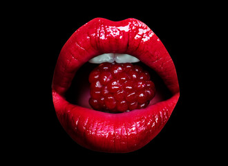 Girl mouth eating raspberry closeup on black background. Sexy open mouth with red lipstick, white teeth. Delicious food, raspberry berry. Diet and vitamins, red berry. Seductive girl, shiny lip gloss