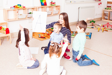 Teacher teaches preschoolers