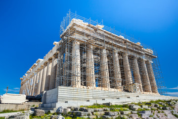 Restoration work in progress at world heritage ancient Parthenon with machine crane, scaffolding...