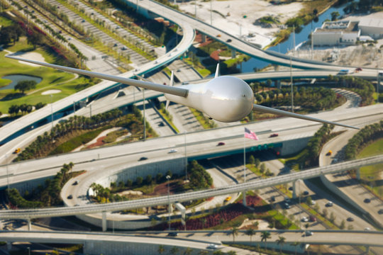 3D rendering of a drone surveilling traffic over the freeway
