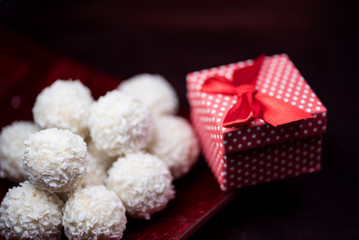 Colorful red gift box with jewellery and sweet rafaello - valentine gift