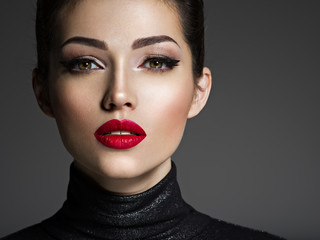 Beautiful young fashion woman with red lipstick.