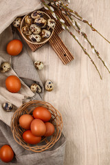 quail and chicken eggs with willow branches wyth textile. Springtime. Top view. Copyspace. Happy easter