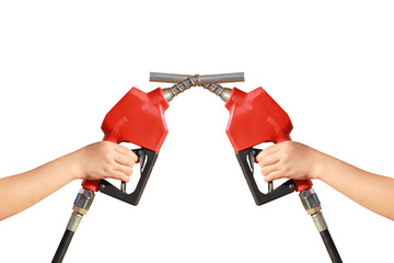 Woman hand holding two a fuel nozzle red on white background