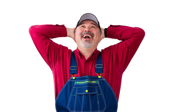 Cheerful man wearing dungarees on white background