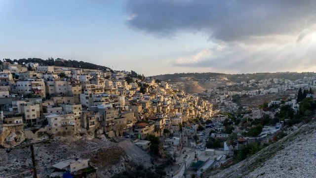 Cinemagraph of the sun shining on a Middle Eastern village. Seamless and endless loop time lapse.