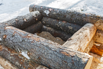 Outward small kennel or booth blockhouse fragment with corner at winter forest