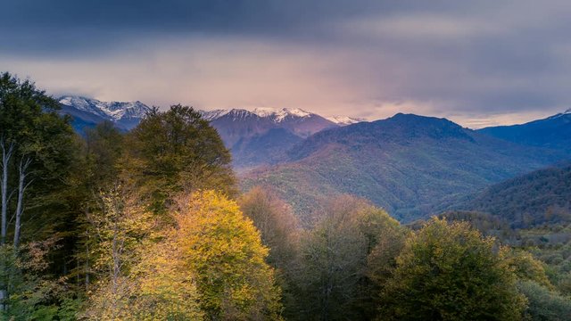 Cinemagraph of a cloudscape time lapse over a mountain range in Fall rendered in an endless and seamless loop.