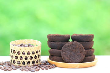 Coffee ground and Coffee beans on natural green background