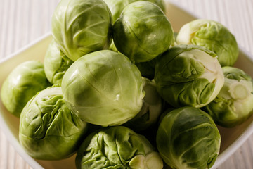Brussels sprouts on a rustic wooden background