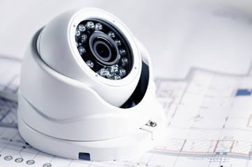 Video security equipment and blueprint on a table. Soft focus photo Good for security service engineering company site or advertising