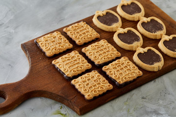 Top view close-up picture of tasty cookies on the cutting board, shallow depth of field, selective focus