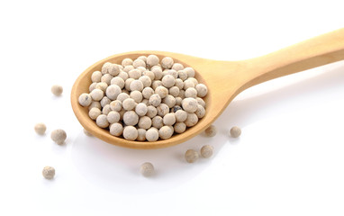 white Pepper seeds in wooden spoon