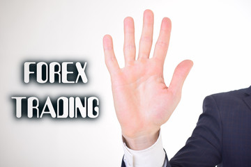 A businessman shows an inscription:FOREX TRADING