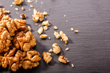 Walnut on a dark rustic wooden background