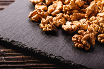 Walnut on a dark rustic wooden background