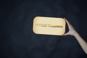 A businessman shows an inscription:FOREX TRADING