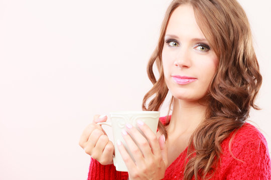 Autumn woman holds mug with coffee warm beverage
