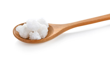 salt in wood spoon on white background