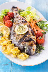 Orata arrosto con contorno di verdure, whole roast bream with vegetables, Mediterranean Cuisine 
