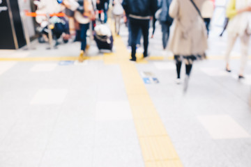 Blurred people in train station movement rush hour
