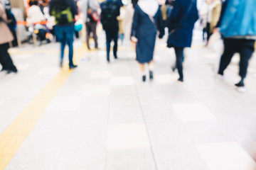 Blurred people in train station movement rush hour