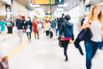 Blurred people in train station movement rush hour