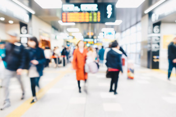 Blurred people in train station movement rush hour