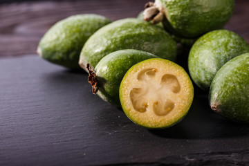 fresh fruits of the feijoa on the rustic background