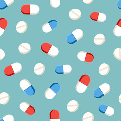 Seamless pattern with pills and capsules on green background. Vector illustration